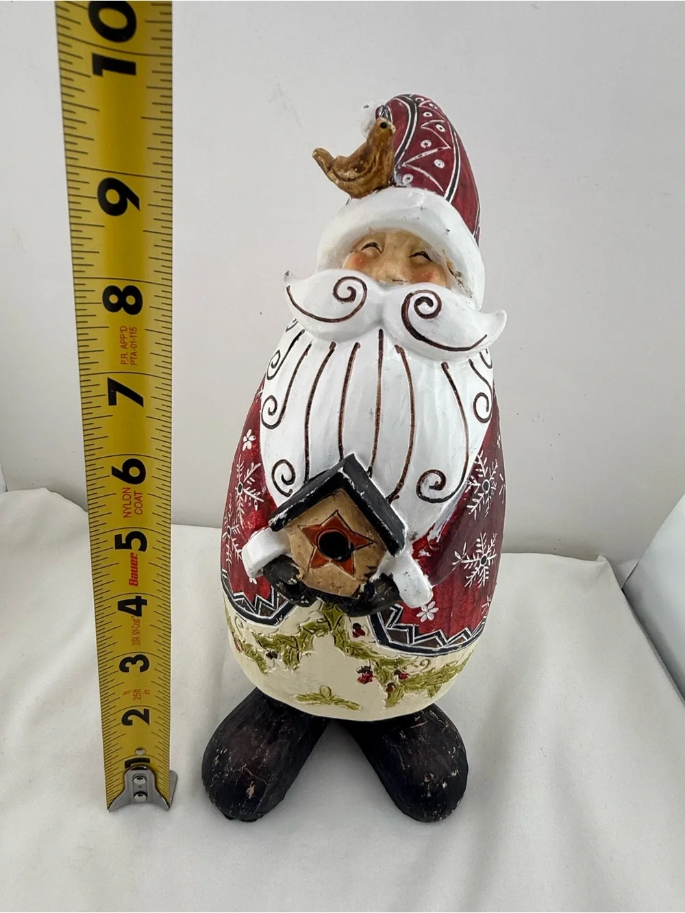Folk art style resin Santa Claus figurine